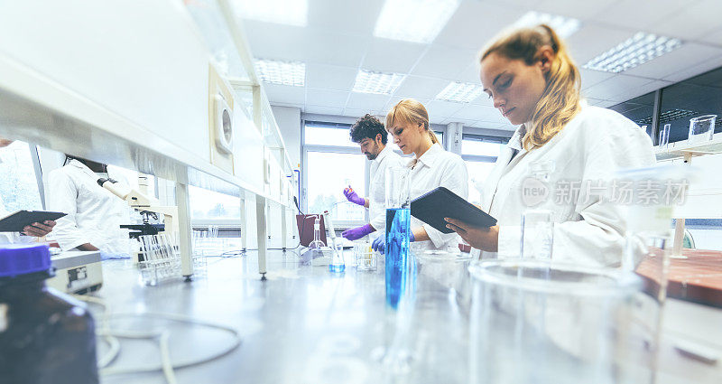 Group of scientists working in laboratory